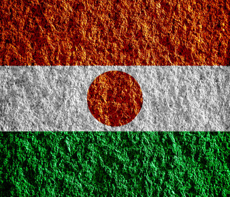 Flag of Republic of Niger on a textured background. concept collage.の写真素材