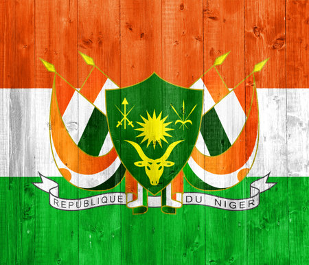 Flag and coat of arms of Republic of Niger on a textured background. concept collage.の写真素材