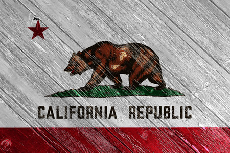 Flag of USA state California on a textured background. concept collage.の写真素材