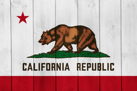 Flag of USA state California on a textured background. concept collage.の写真素材