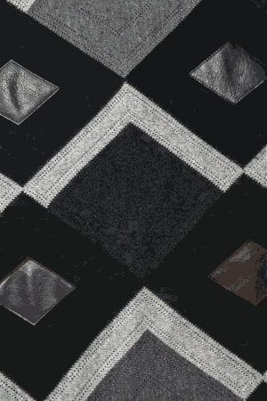 Realistic vector illustration abstract fabric texture.Detailed inserts in black genuine leather on a knitted woolen background with an abstract pattern.のイラスト素材
