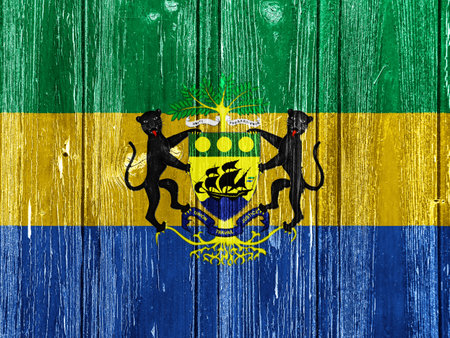 Flag and coat of arms of the Republic of Gabon on a textured background. concept collage.の写真素材