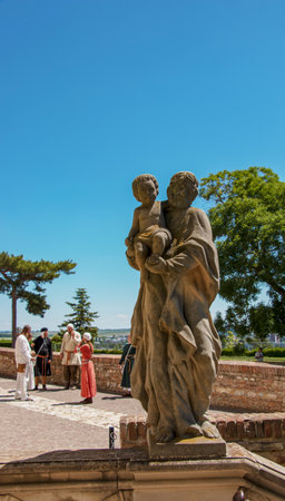 Castle, Nitra, Slovakia - 12/06/2022: Sculpture of a holy man in the castle in Nitra, Slovakia.のeditorial素材