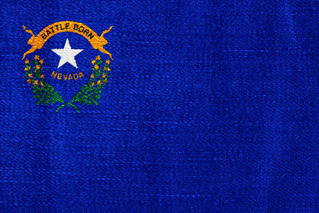 US state flag of Nevada on a textured background. concept collage.の写真素材