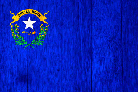 US state flag of Nevada on a textured background. concept collage.の写真素材