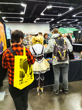 Portland, Oregon, USA - 09.23.2023: Comic Con Convention. People dressed in costumes of famous movie and cartoon characters. Famous objects from films and cartoons.のeditorial素材