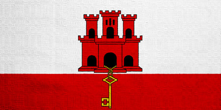 Gibraltar flag on a textured background. concept collage.の写真素材