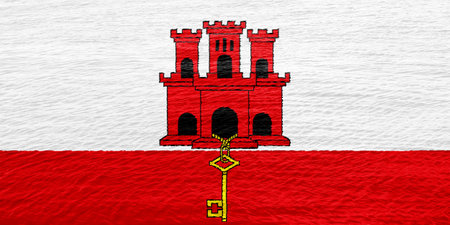 Gibraltar flag on a textured background. concept collage.の写真素材