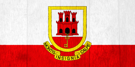 Gibraltar flag and coat of arms on a textured background. Concept collage.の写真素材