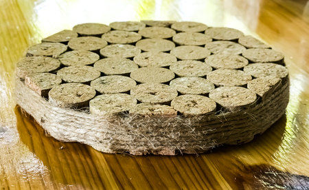 A stand for hot objects made from wine corks. Kitchen items.の写真素材