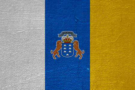 Flag and coat of arms of Canary Islands on a textured background. Concept collage.の写真素材