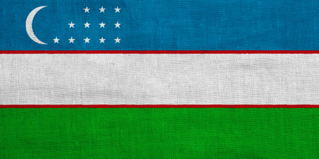 Flag of Republic of Uzbekistan on a textured background. Concept collage.の写真素材