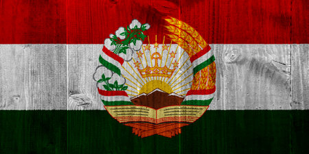 Flag and coat of arms of the Republic of Tajikistan on a textured background. Concept collage.の写真素材