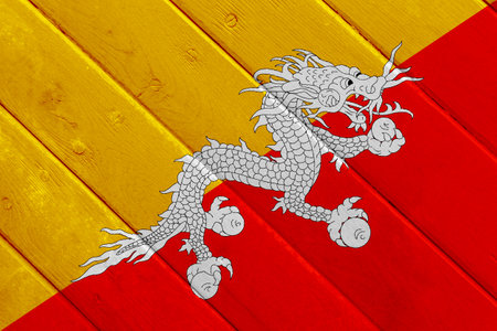 Flag of Kingdom of Bhutan on a textured background. Concept collage.の写真素材