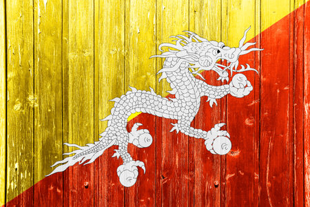 Flag of Kingdom of Bhutan on a textured background. Concept collage.の写真素材