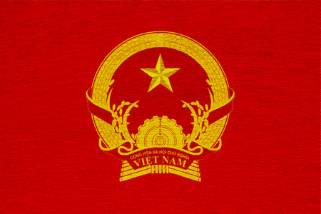 Flag and coat of arms of Socialist Republic of Vietnam on a textured background. Concept collage.の写真素材