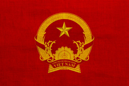 Flag and coat of arms of Socialist Republic of Vietnam on a textured background. Concept collage.の写真素材