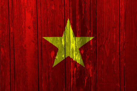 Flag of Socialist Republic of Vietnam on a textured background. Concept collage.の写真素材