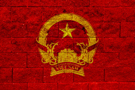 Flag and coat of arms of Socialist Republic of Vietnam on a textured background. Concept collage.の写真素材