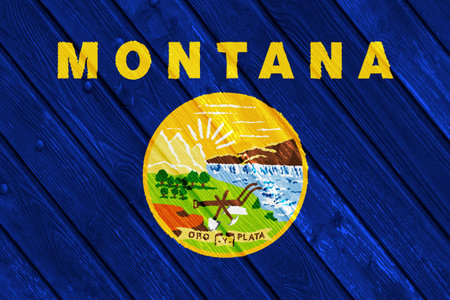 Flag of Montana USA state on a textured background. Concept collage.の写真素材