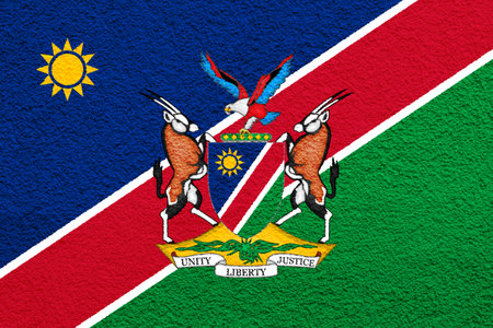Flag and coat of arms of the Republic of Namibia on a textured background. Concept collage.の写真素材