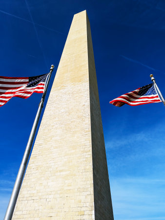 Low angle view of the Washington Monument under clear blue sky in Washington, DCの写真素材