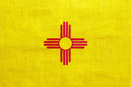 Flag of New Mexico state USA on a textured background. Concept collage.の写真素材