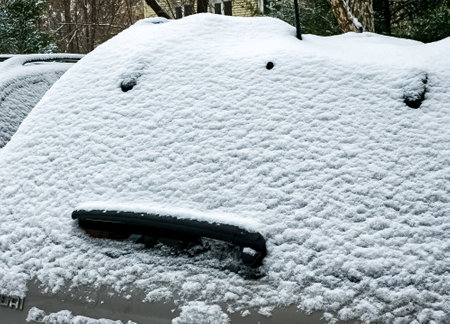 Close-up of the trunk of a modern car covered in snowの写真素材