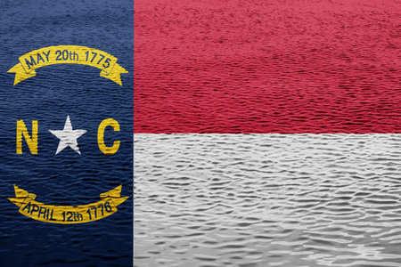 Flag of North Carolina state USA on a textured background. Concept collage.の写真素材