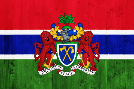 Flag and coat of arms of the Republic of Gambia on a textured background. Concept collage.の写真素材