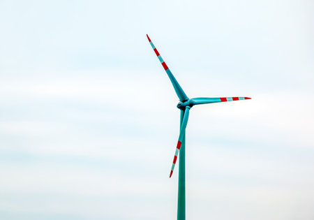 Wind station turbine windmill park next to the road in Austria in cloudy weather.