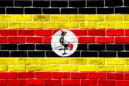 Flag of Republic of Uganda on a textured background. Concept collage.の写真素材
