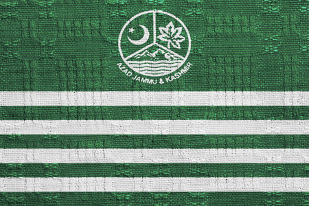 Flag of and coat Azad Kashmir on a textured background. Concept collage.