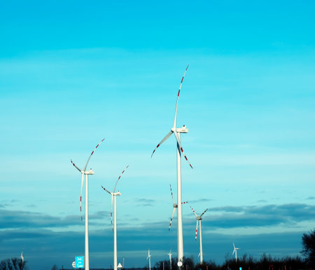 Wind farm park next to a road in Austria in sunny weather.の写真素材
