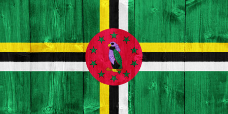 Flag of Commonwealth of Dominica on a textured background. Concept collage.の写真素材