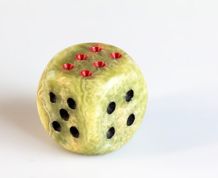Onyx dices with red and black dots against white background