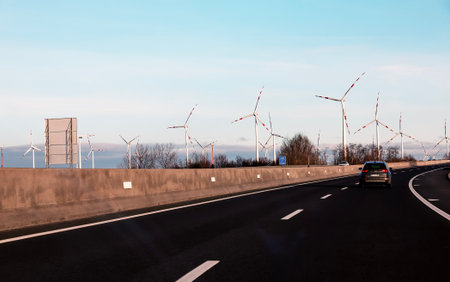Austria, road to Vienna from Bratislava - 14/01/2024: Wind farm park next to a road in Austria in...