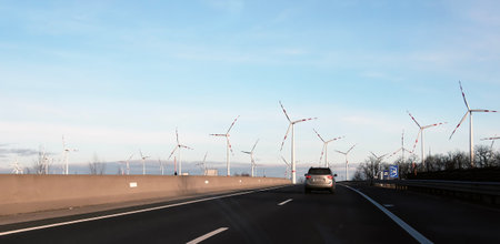 Austria, road to Vienna from Bratislava - 14/01/2024: Wind farm park next to a road in Austria in...