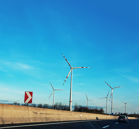 Austria, road to Vienna from Bratislava - 14/01/2024: Wind farm park next to a road in Austria in...
