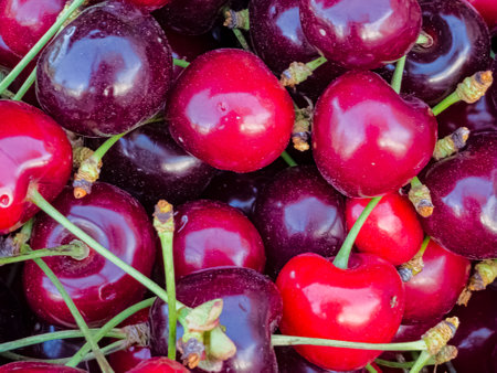 Delicious ripe sweet cherries as background, top view.