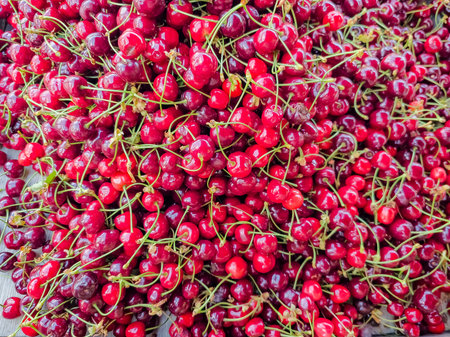 Delicious ripe sweet cherries as background, top view.の写真素材