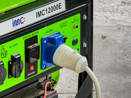 Power supply generator placed on street sidewalk. Outdoor diesel power generator.
