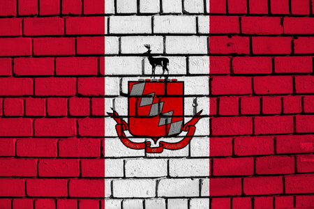 Flag of the city of Raleigh, North Carolina, USA, on a background of a brick wall. Conceptual collage.の写真素材