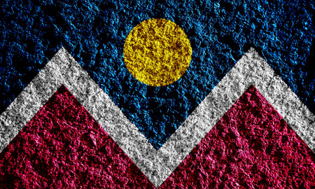 Flag of the city of Denver, Colorado, USA, on a background of a plaster wall. Conceptual collage.の写真素材