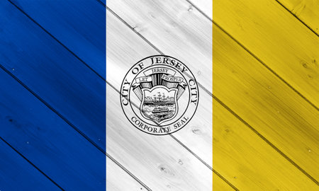 Flag of the city of Jersey City, New Jersey, USA, on a background of a wooden fence. Conceptual...