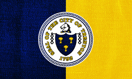 Flag of the city of Trenton, New Jersey, USA, on a background of fabric texture. Conceptual collage.
