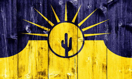 Flag of the city of Mesa, Arizona, USA, on a background of a wooden fence. Conceptual collage.の写真素材