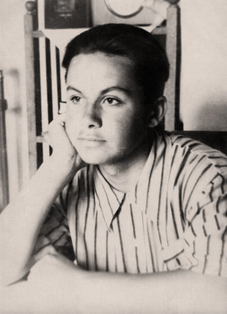 Retro portrait of a handsome young man in a shirt. Vintage photo from 1950.の写真素材