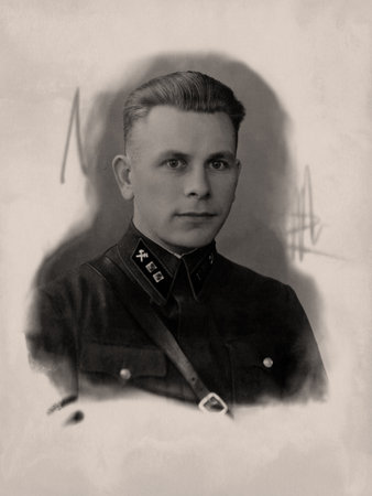 Vintage photo of a young man in military uniform. Retro portrait made in the USSR around 1938.