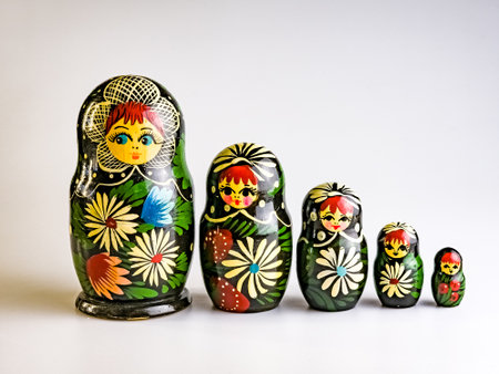 Five Matryoshkas, Russian wooden doll on a white background. Painted with flowers.の写真素材